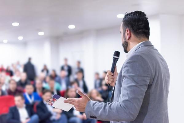 businessman-giving-presentations-at-conference-room-free-photo